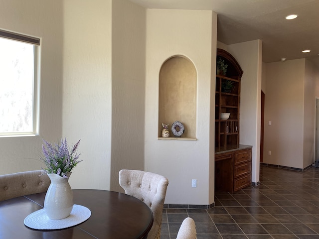 dining area with recessed lighting and dark tile patterned flooring