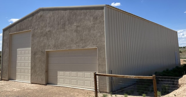 detached garage with fence