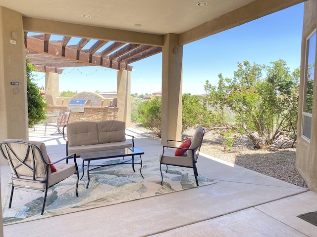 view of patio featuring an outdoor hangout area, an outdoor kitchen, and a pergola