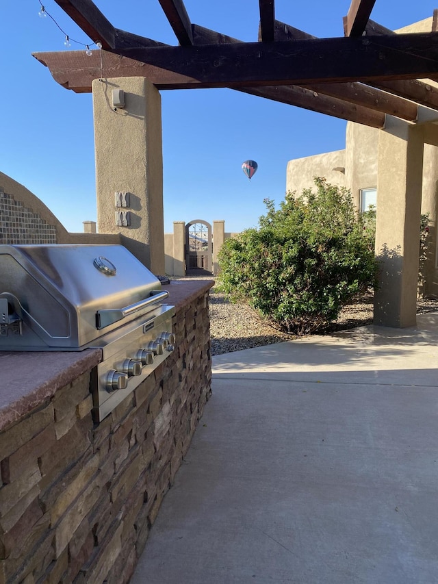 view of patio with area for grilling and grilling area