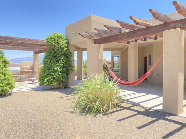 view of patio featuring a pergola