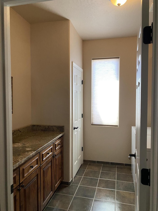 interior space with dark tile patterned floors