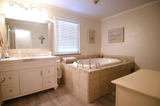 full bathroom with a bath, vanity, crown molding, and wood finished floors