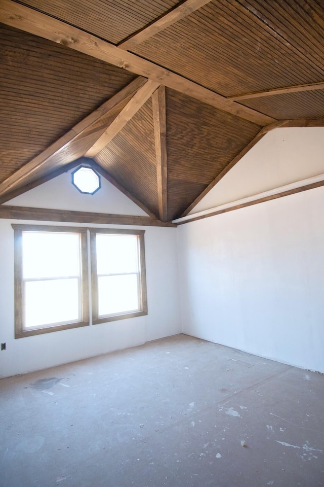 unfurnished room featuring lofted ceiling