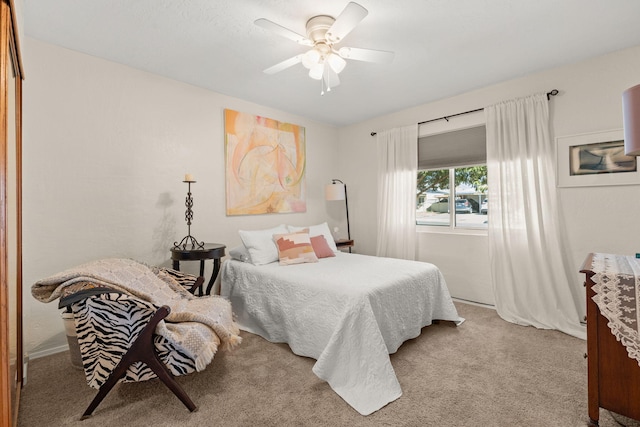 carpeted bedroom with a ceiling fan