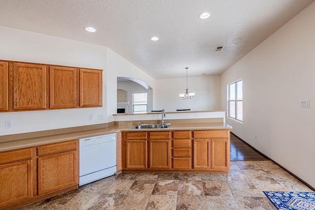 kitchen featuring visible vents, arched walkways, a sink, dishwasher, and a chandelier