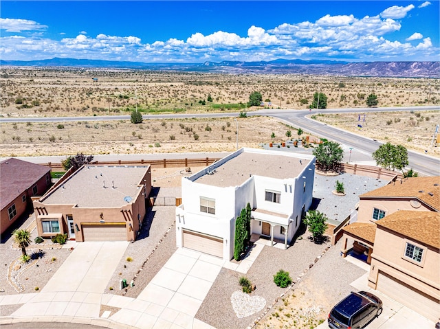 aerial view featuring a mountain view and view of desert