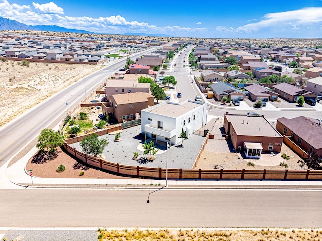 aerial view featuring a mountain view and a residential view