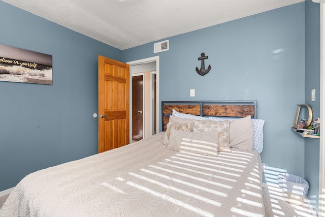 bedroom featuring visible vents