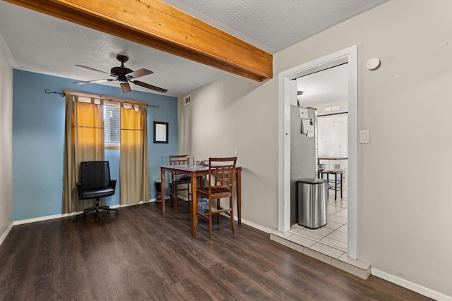 dining space with a textured ceiling, a ceiling fan, and wood finished floors