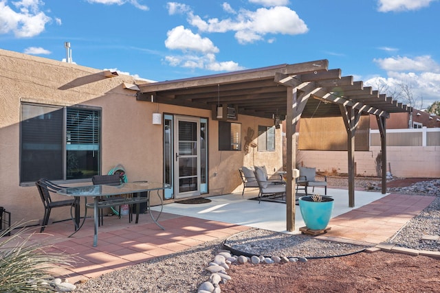 view of patio / terrace with a pergola, outdoor dining area, and fence