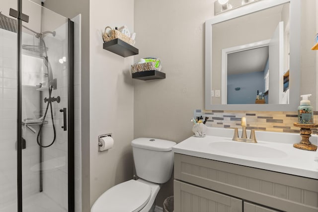 full bath featuring tasteful backsplash, a shower stall, and toilet