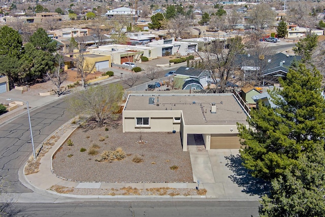 birds eye view of property with a residential view