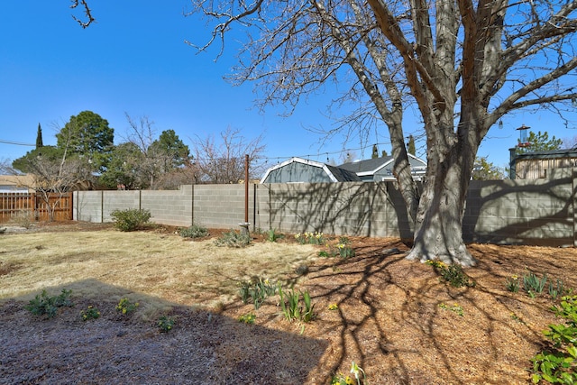 view of yard with a fenced backyard