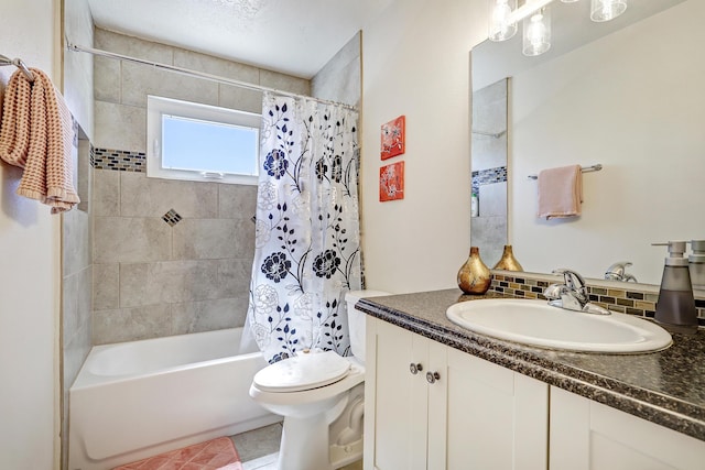 full bath featuring tile patterned floors, shower / bath combo with shower curtain, toilet, backsplash, and vanity