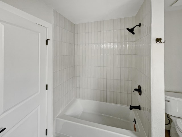 bathroom with shower / bathing tub combination and toilet