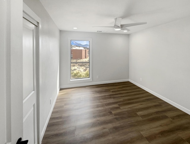 unfurnished room with a ceiling fan, baseboards, visible vents, recessed lighting, and dark wood-type flooring