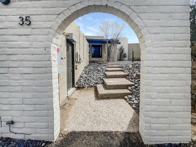 exterior space featuring arched walkways