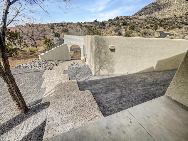 view of patio featuring a gate and fence