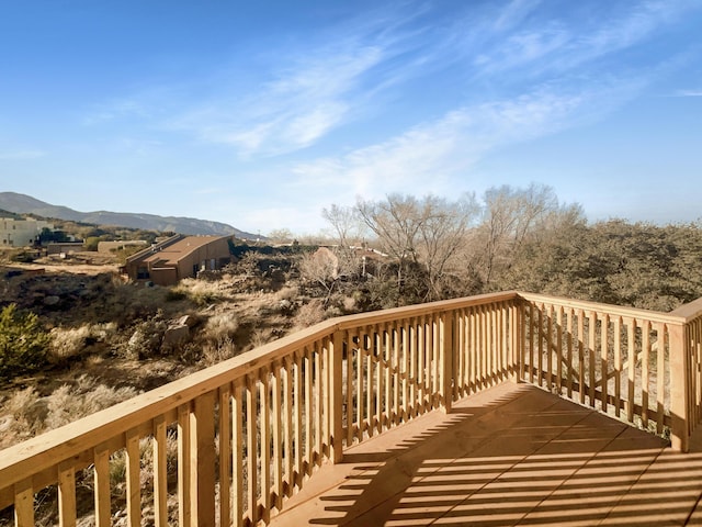 wooden terrace featuring a mountain view