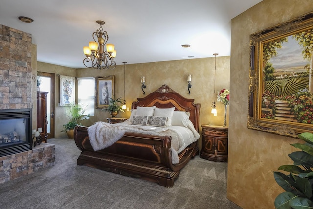 carpeted bedroom featuring a chandelier, visible vents, and a fireplace