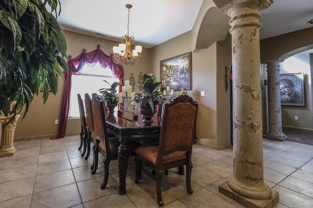 dining area with arched walkways, light tile patterned floors, an inviting chandelier, and ornate columns