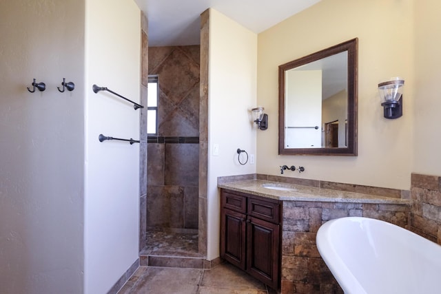 bathroom with a tile shower, tile patterned floors, a bath, and vanity