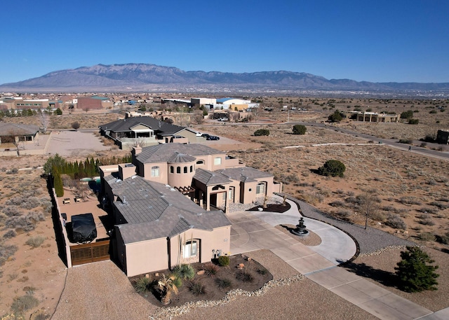 drone / aerial view featuring a mountain view