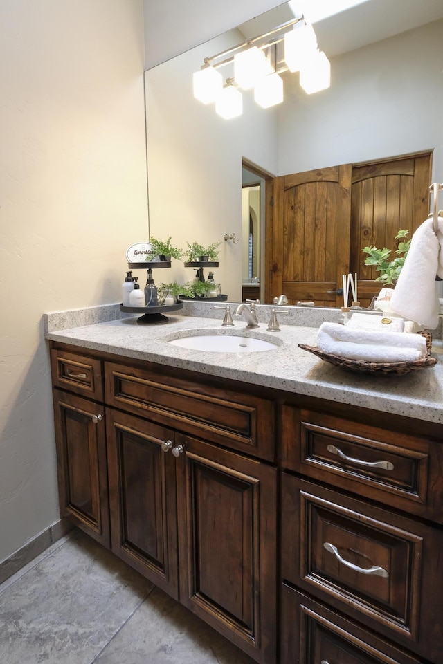 bathroom featuring double vanity and a sink