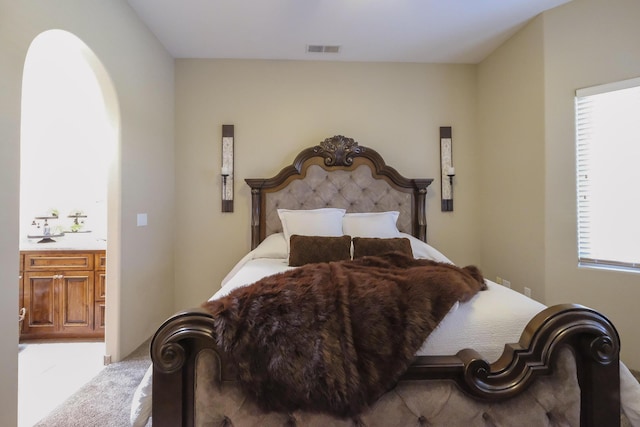 bedroom featuring visible vents