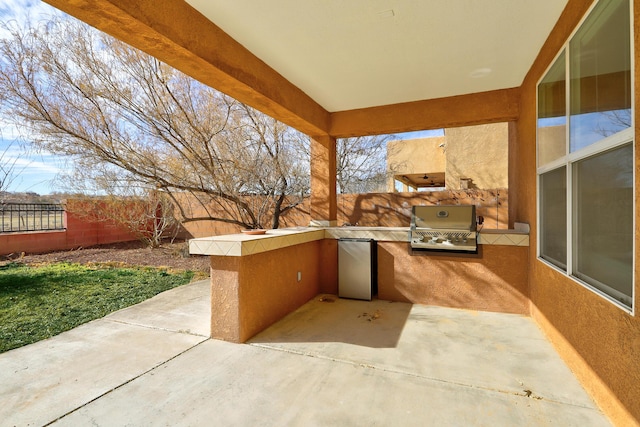 view of patio featuring area for grilling, a grill, and a fenced backyard