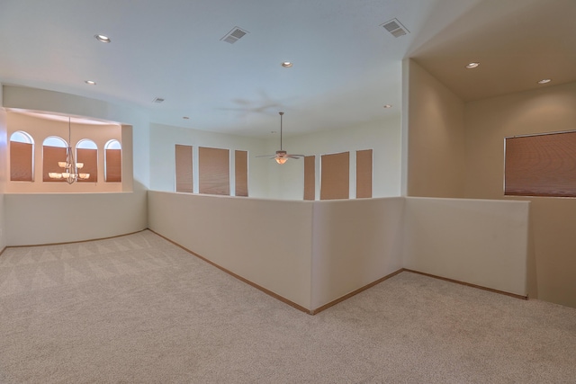 hall featuring a notable chandelier, carpet flooring, recessed lighting, and visible vents