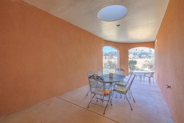 view of patio featuring outdoor dining area