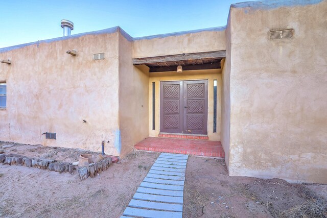 3805 Riverview Rd NW, Albuquerque, NM 87105 - doorway to property with crawl space and stucco siding