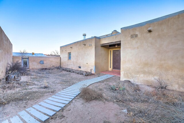 3805 Riverview Rd NW, Albuquerque, NM 87105 - doorway to property with stucco siding
