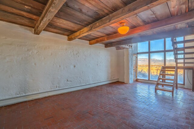 3805 Riverview Rd NW, Albuquerque, NM 87105 - empty room with a wood ceiling with exposed beams, brick flooring, and a textured wall