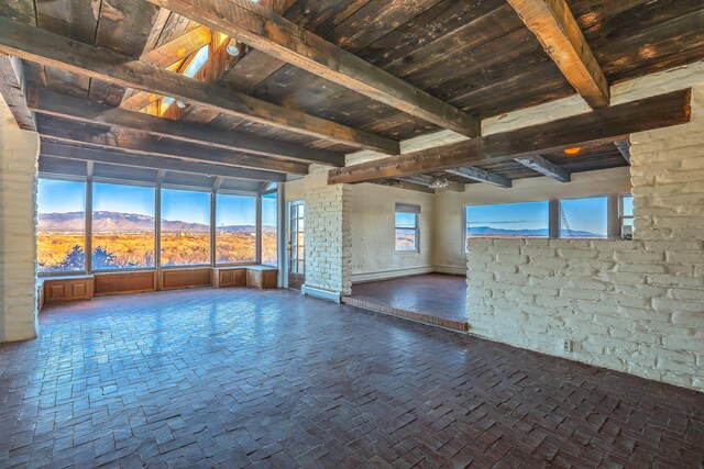 3805 Riverview Rd NW, Albuquerque, NM 87105 - empty room with a wood ceiling with exposed beams and a mountain view