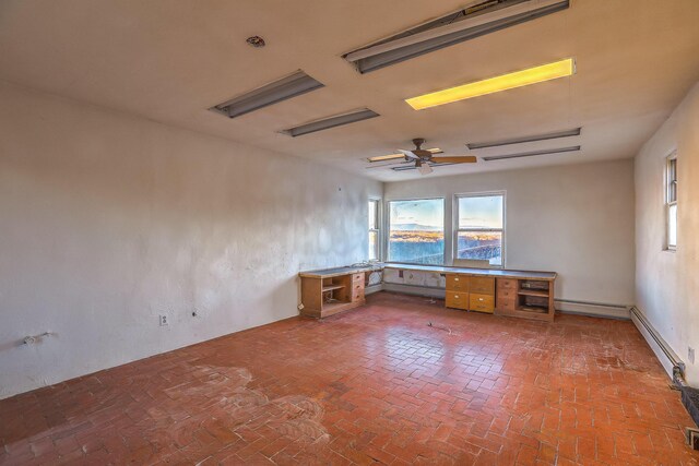 3805 Riverview Rd NW, Albuquerque, NM 87105 - empty room featuring brick flooring, healthy amount of natural light, and ceiling fan