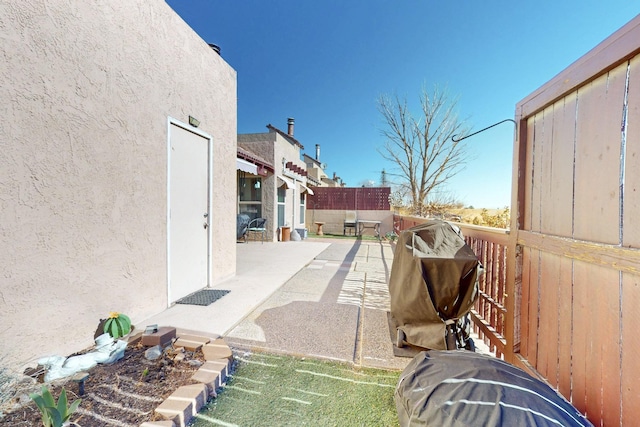 view of patio featuring fence