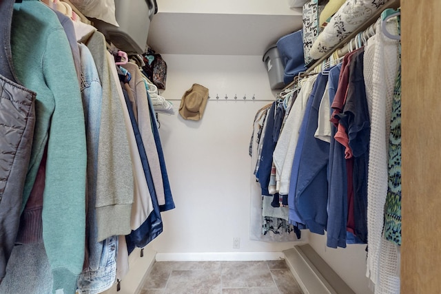 walk in closet featuring tile patterned flooring