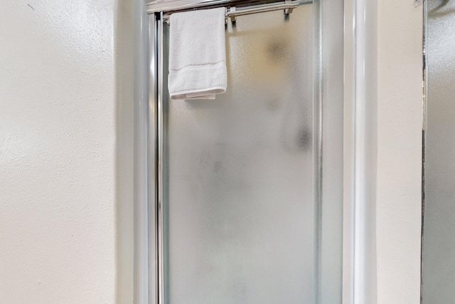 bathroom with a shower stall