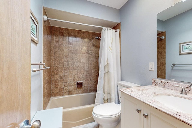 full bathroom with vanity, shower / bath combination with curtain, and toilet