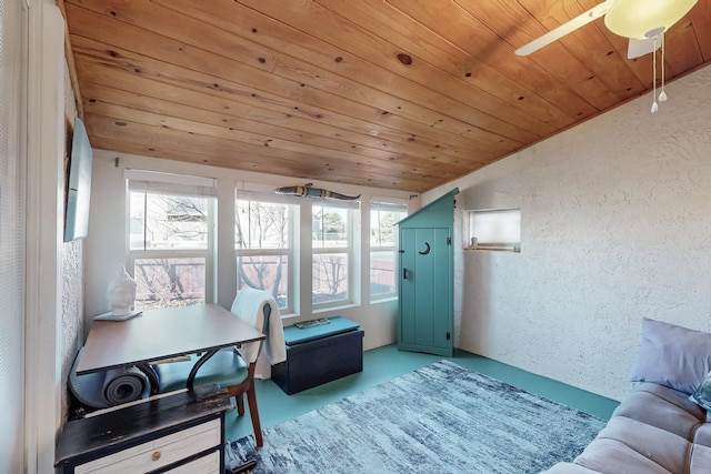 home office featuring plenty of natural light, wood ceiling, lofted ceiling, and a textured wall