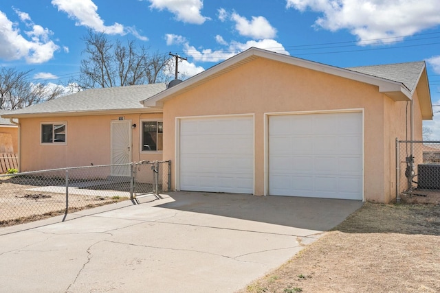 single story home with stucco siding, fence, roof with shingles, a garage, and central AC unit