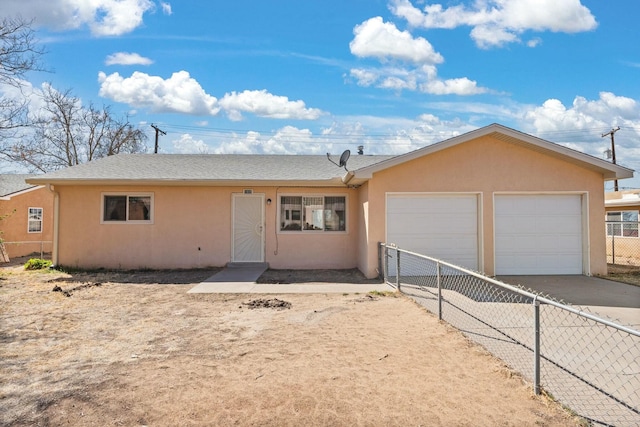 ranch-style home featuring stucco siding, driveway, fence, roof with shingles, and an attached garage