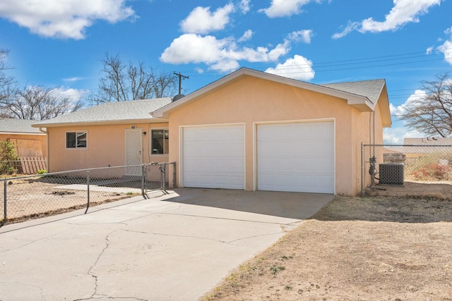 ranch-style house featuring stucco siding, fence, cooling unit, concrete driveway, and a garage