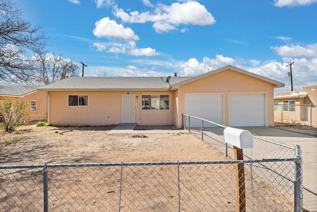 view of front of home featuring stucco siding, driveway, fence private yard, and a garage