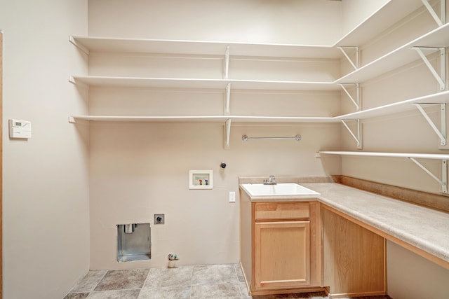 laundry area featuring a sink, gas dryer hookup, hookup for an electric dryer, hookup for a washing machine, and laundry area