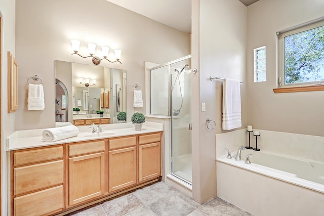 full bath featuring a bath, tile patterned flooring, a shower stall, and vanity