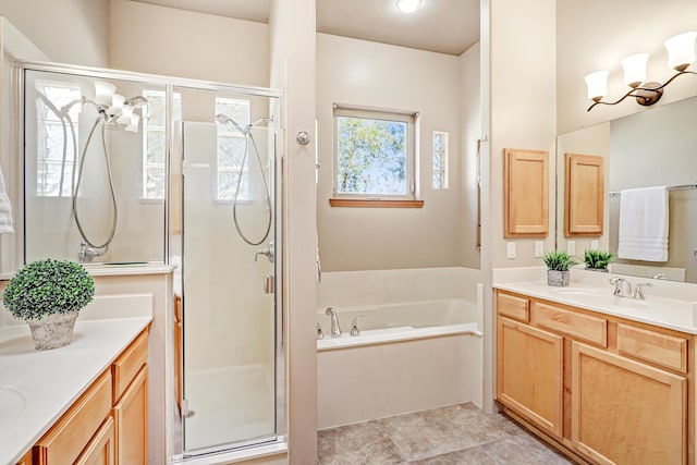 full bath featuring tile patterned flooring, a shower stall, a bath, a chandelier, and vanity